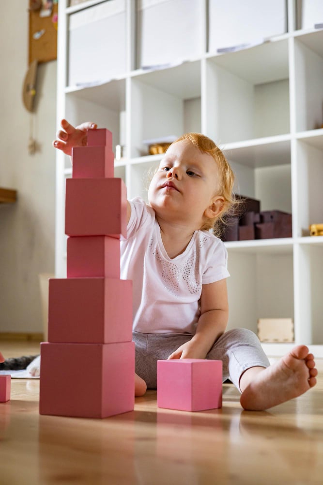 Toddler Engaged in Block Stacking Activity